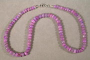 Lavender sugilite rondelle beads.